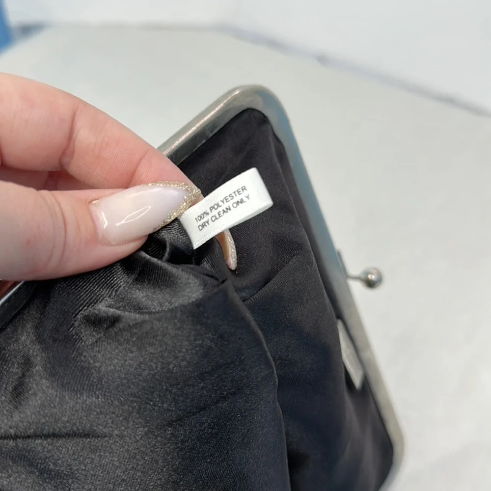 Carolina Herrera kiss lock black and silver clutch